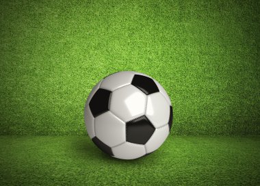 Futbol topu ile yeşil çizgili futbol sahası manzarası