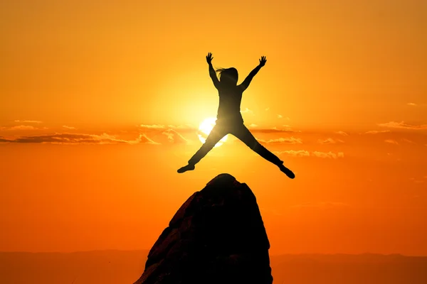 Jumping woman on the Peak — Stock Photo, Image