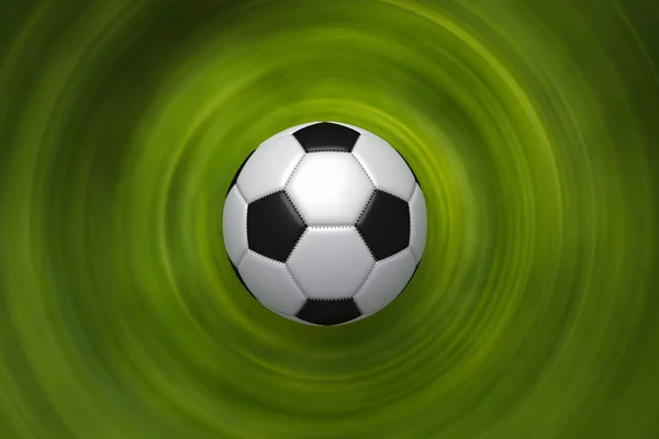 Зеленый фон с футбольным мячом — стоковое фото