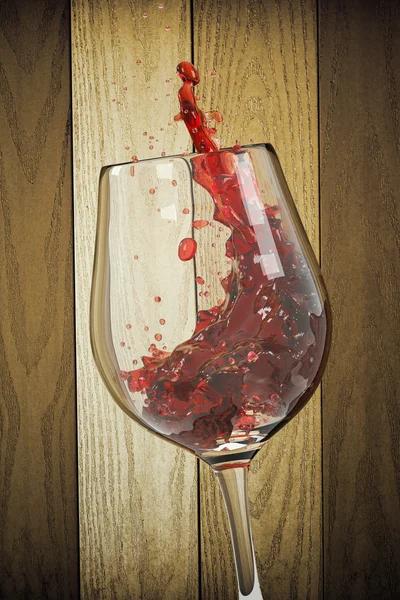 Red wine into the glass with wooden background — Stock Photo, Image
