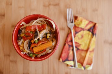 pasta with vegetable on wooden table