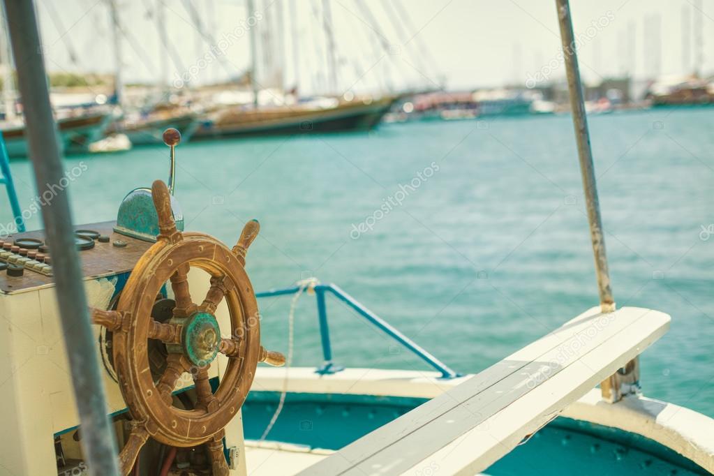 Old boat steering wheel from wood — Stock Photo © sonerbakir 80844876