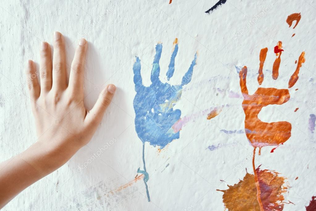 Painting wall with hands