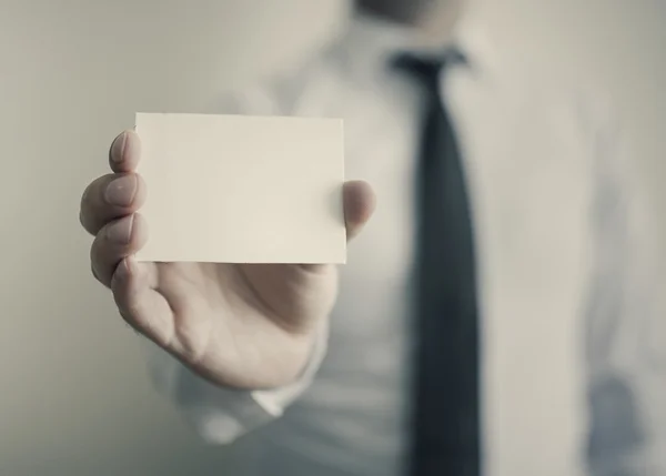 Mans hand showing business card — Stock Photo, Image