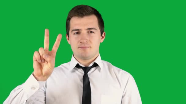 Man showing 2 fingers on green screen — Stock Video