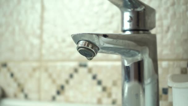 Dripping bathroom faucet close up — Stock Video