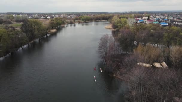 Aerial shooting of moving kayaks along the river bed. — Stock Video