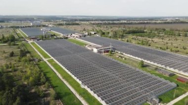 movement of the drone along the pile of greenhouses. aerial shooting.