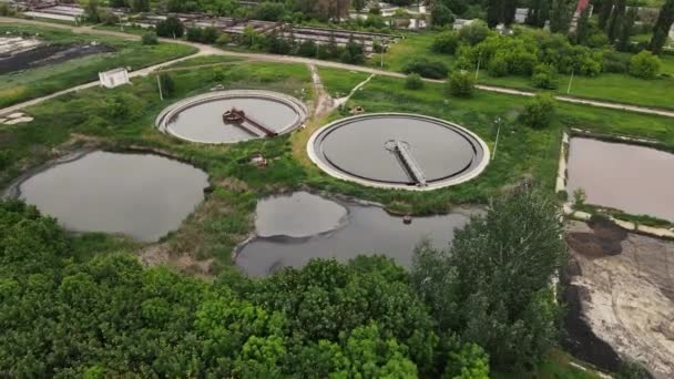 Treatment plant is located near the city. aerial shooting — Stock Video