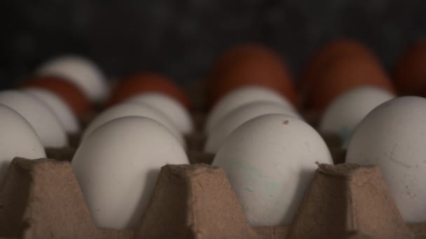 Cob of chicken eggs lying on the table close-up — Stock Video