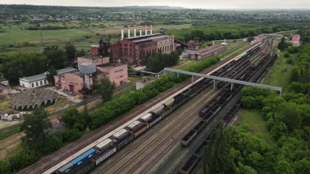 Drone movement along railway tracks with a bunch of wagons — Stock Video