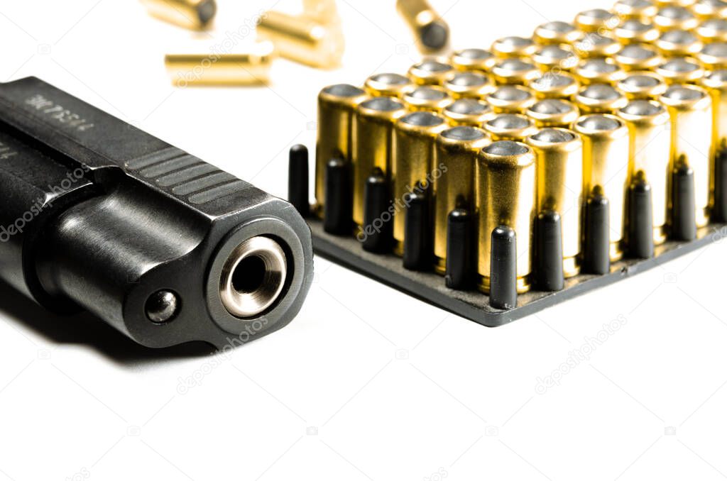 The legal traumatic short-barrel weapon lies on a white background next to the cartridges. Legalization of weapons