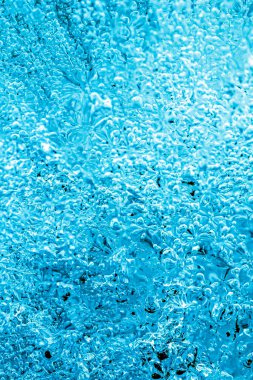 Frost. Winter background. Ice with close-up air bubbles. Winter.