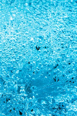 Frost. Winter background. Ice with close-up air bubbles. Winter.