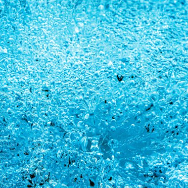 Frost. Winter background. Ice with close-up air bubbles. Winter.