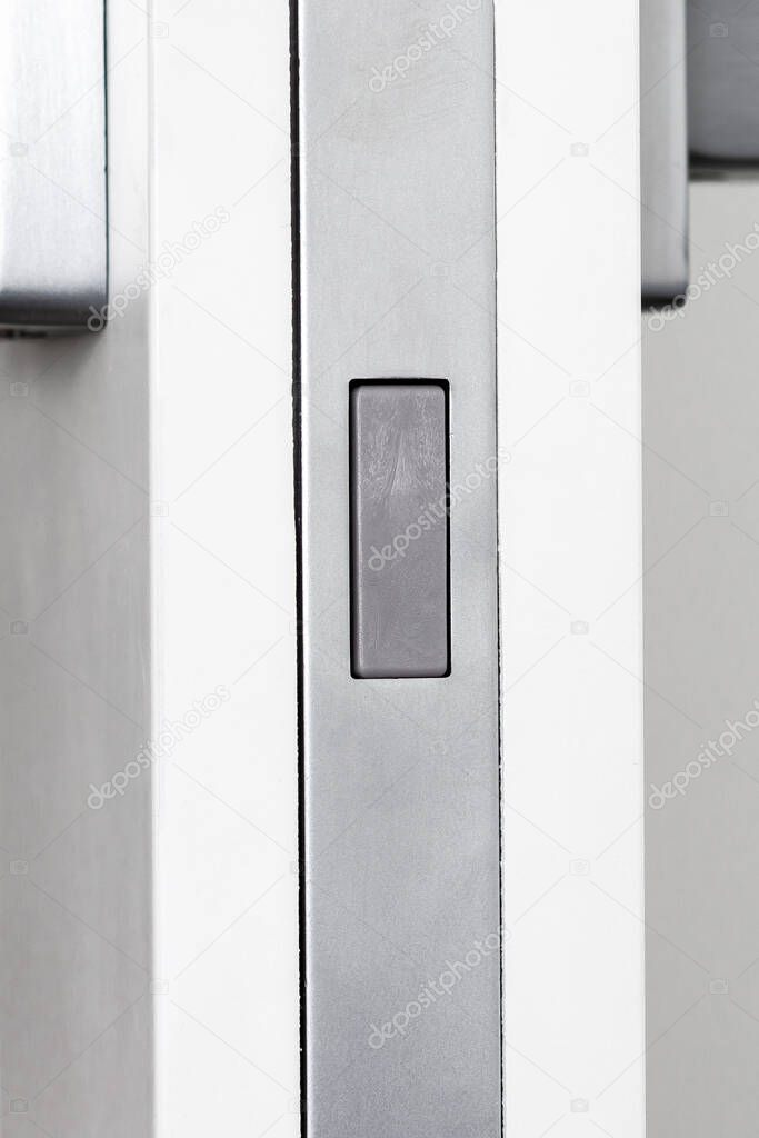 Magnetic mechanism and door handles for inter-room doors close-up