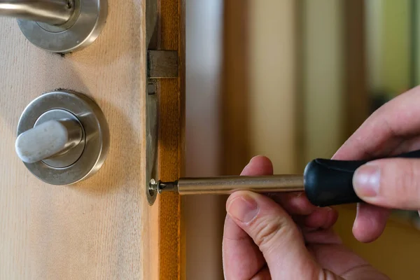 Carpenter Repairing Door Lock Installing Door Handle Handyman Tightening Door — Stock Photo, Image