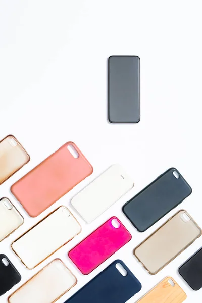 Pile Multicolored Plastic Back Covers Mobile Phone White Background Choice — Stock Photo, Image