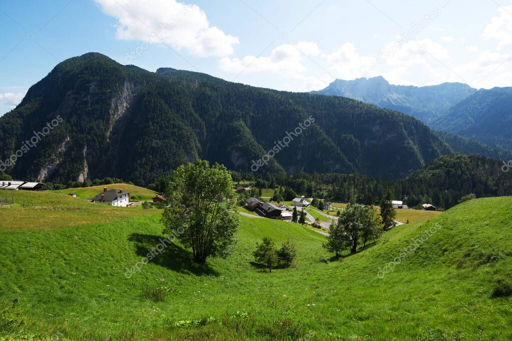 Sauris with its beautiful lake and its suburbs
