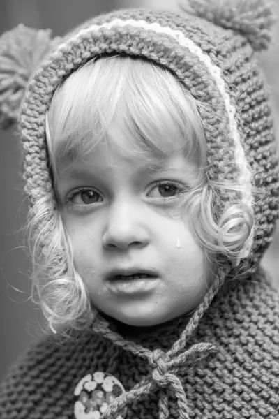 Two-year-old sad girl - black and white Stock Photo