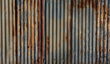 a partially rusted corrugated iron fence background texture clipart