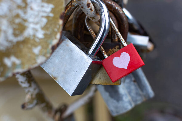 Love metal padlock with painted white heart