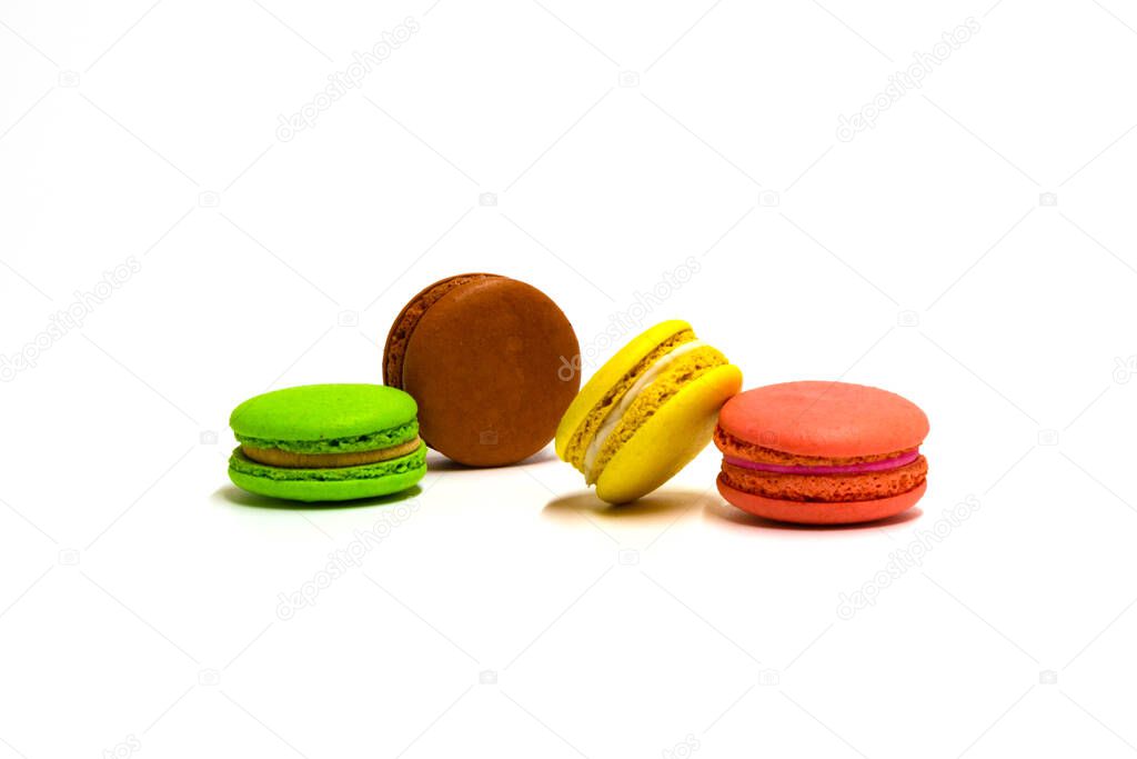 multicolored four macaroons on a white background