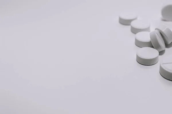 Several White Pills White Background Upper Corner Photo Black White — Foto Stock