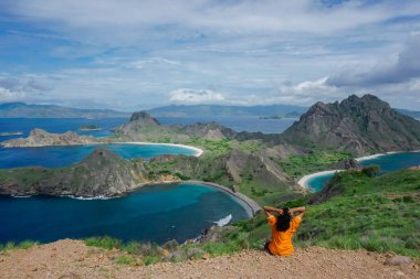 Indonesian girl on Padar island in the waters of the Komodo Islands clipart