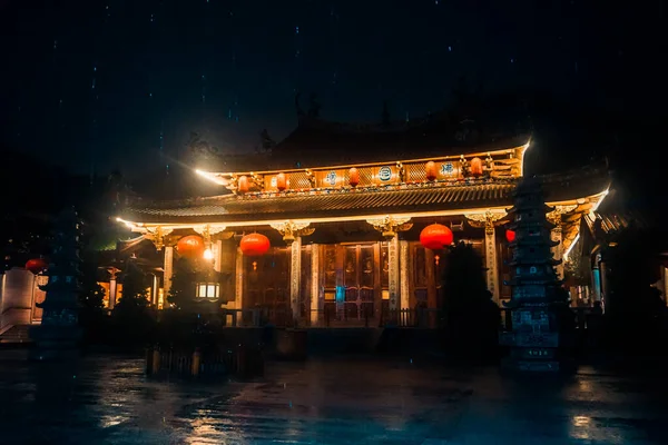 Beautiful chinese temple at night during the rain