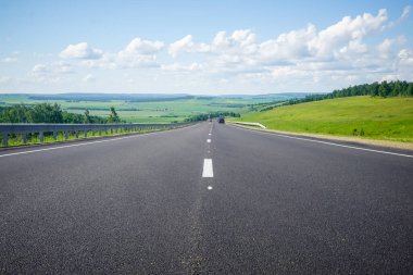 The road in Siberia at the beginning of summer