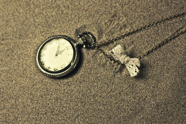 Antique clock in the sand — Stock Photo, Image