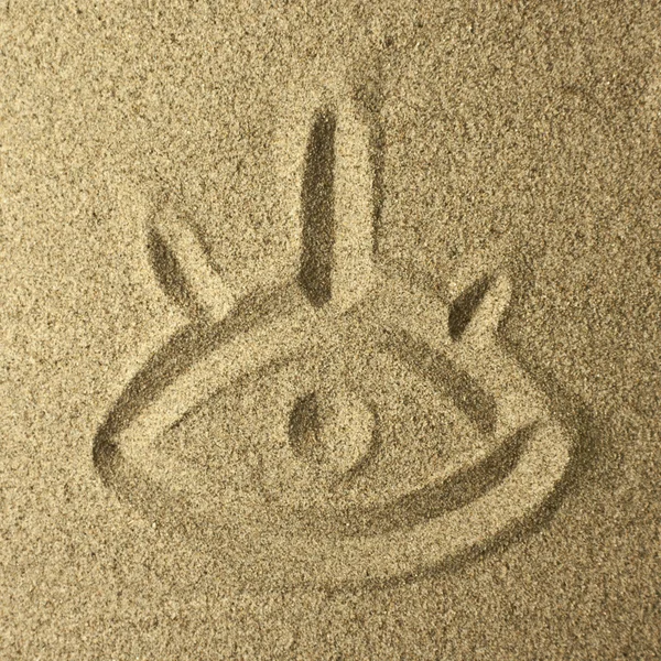 Eye handwriting in the sand — Stock Photo, Image