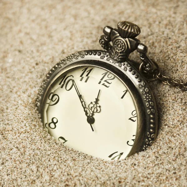 Antique clock in the sand — Stock Photo, Image