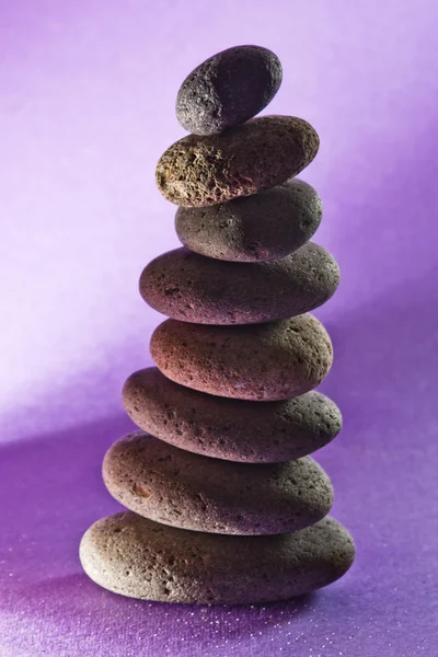 Eight  stones in the sand,black-ground purple — Stock Photo, Image