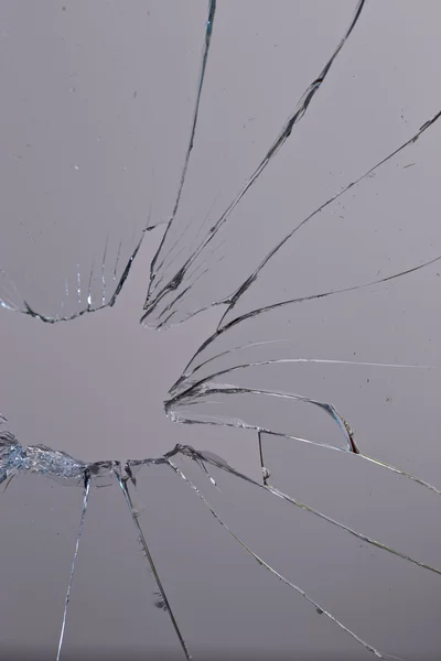 Broken glass grey  background — Stock Photo, Image