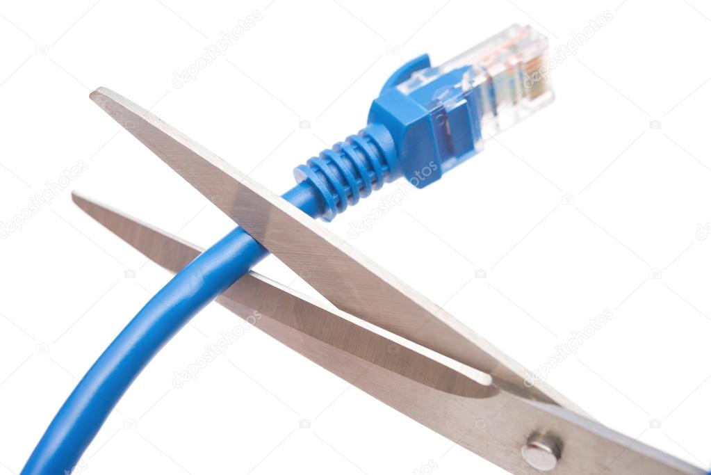 cutting a blue network cable with scissors on white