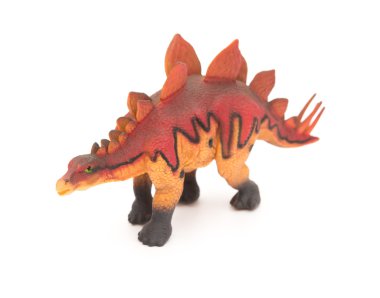yan görünümü kırmızı stegosaurus oyuncak beyaz bir arka plan üzerinde