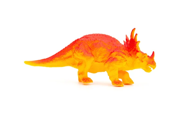 Vista laterale arancio triceratops giocattolo su sfondo bianco — Foto Stock