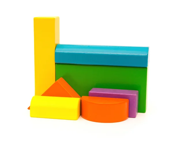 Different color and shape wooden toy blocks on white background — Stock Photo, Image