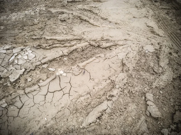 Dry soil with tyre mark on the ground — Stock Photo, Image