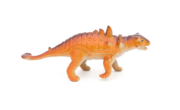 Vista lateral naranja Pinacosaurus juguete sobre un fondo blanco — Foto de Stock