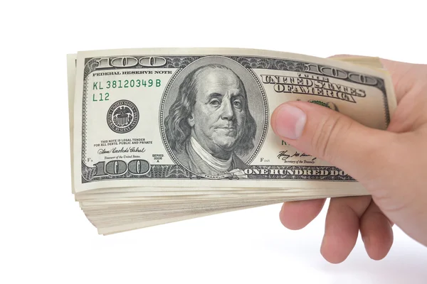 Hand holding stacks of 100 USD paper currency on white with clipping path — Stock Photo, Image