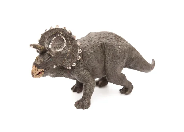 Grå triceratops leksak på en vit bakgrund — Stockfoto