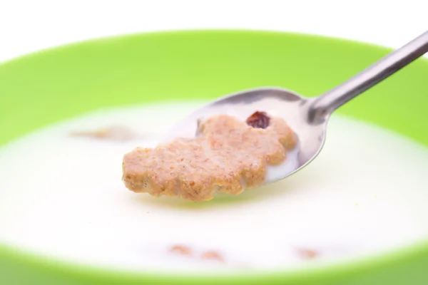 Spoon taking out a soaking cracker from bowl of milk with clipping path — Stock Photo, Image