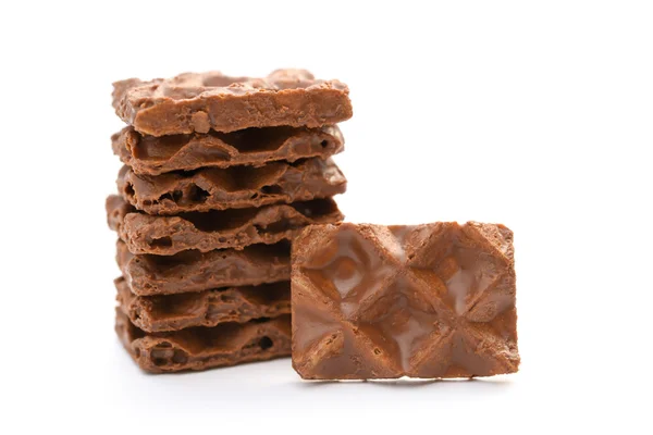 Chocolate blocks stack up on a white background — Stock Photo, Image