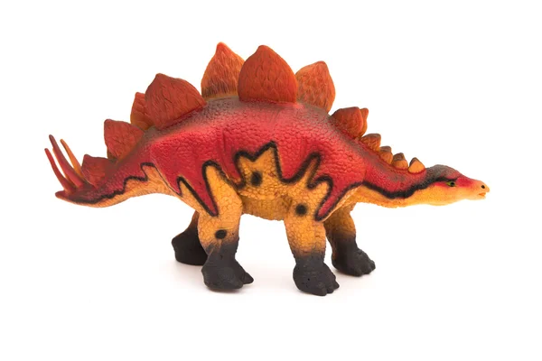 Kant uitzicht rode stegosaurus speelgoed op een witte achtergrond — Stockfoto