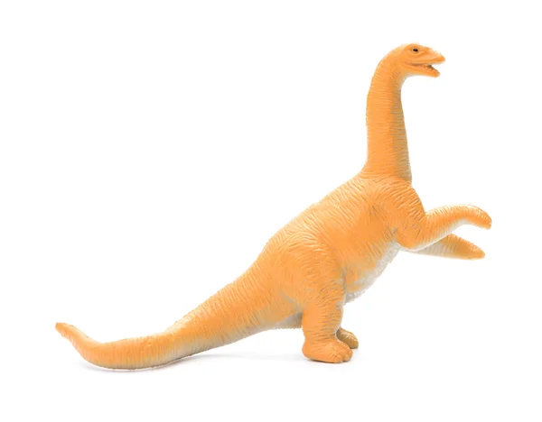 Juguete diplodocus naranja vista lateral sobre un fondo blanco — Foto de Stock