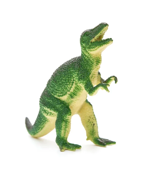 Grön plast dinosaurie leksak på en vit bakgrund — Stockfoto