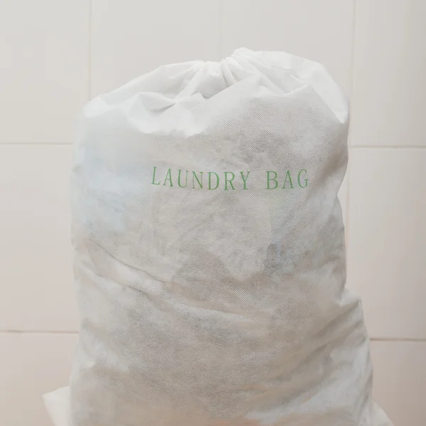 Laundry bag containing dirty washing — Stock Photo, Image